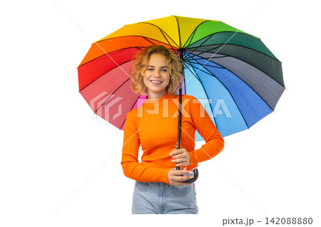 Woman in orange sweater holds rainbow umbrella, isolated on white, PNG Woman in orange sweater holds rainbow umbrella, isolated on white, PNG 142088880