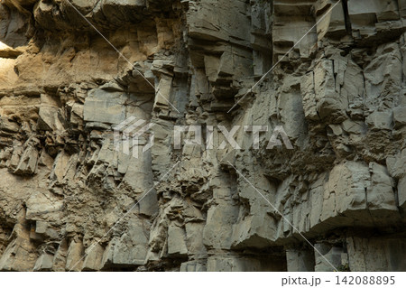 Geological rock formations exhibit unique textures and patterns 142088895