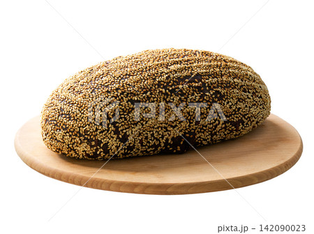 loaf wholemeal rye bread with sunflower seeds and sesame on cutting board, isolated on white background. loaf wholemeal rye bread with sunflower seeds and sesame on cutting board, isolated on white background. 142090023