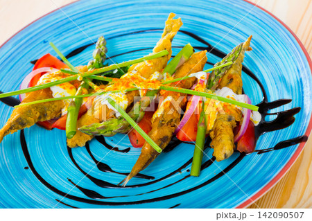 Battered sprats with creamy ginger sauce, tomatoes, balsamic Battered sprats with creamy ginger sauce, tomatoes, balsamic 142090507
