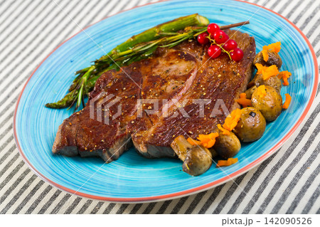 Beef entrecote with mushroom and asparagus is tasty dish 142090526