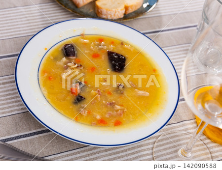 delicious pea soup with smoked meats 142090588