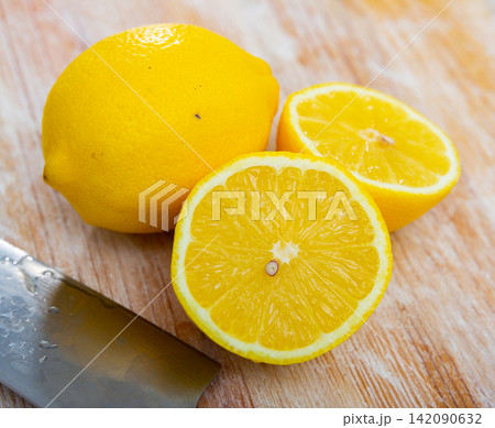 Juicy lemon fruit served to table 142090632
