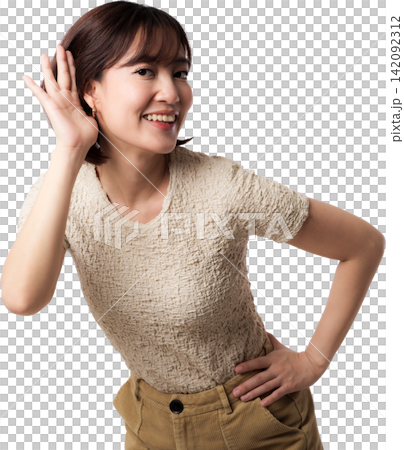 Happy cheerful asian woman listening closely holding hand near ear smiling curious isolated portrait posing joyful indoor background 142092312