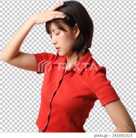 Tired asian woman feeling severe headache pain and stress holding forehead wearing red shirt while standing against isolated background Tired asian woman feeling severe headache pain and stress holding forehead wearing red shirt while standing against isolated background 142092323