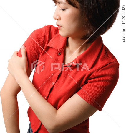 Asian woman feeling painful muscle ache holding injured arm with distressed expression wearing red shirt studio portrait cutout Asian woman feeling painful muscle ache holding injured arm with distressed expression wearing red shirt studio portrait cutout 142092325