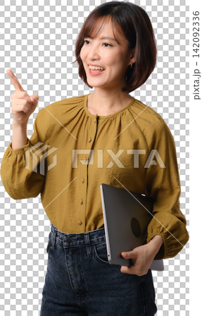 Happy cheerful asian woman pointing finger up holding laptop computer for presentation concept isolated on white studio background 142092336