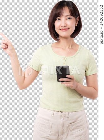 Happy young asian woman holding smartphone and pointing finger upward showing empty copy space against transparency background 142092352