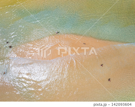 Bird eye view photo of sea beach water surface texture background Bird eye view photo of sea beach water surface texture background 142093604