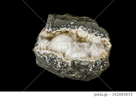 Macro stone Stilbite mineral on white black close up Macro stone Stilbite mineral on white black close up 142093672