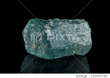 macro mineral stone aquamarine on a black background macro mineral stone aquamarine on a black background 142093789