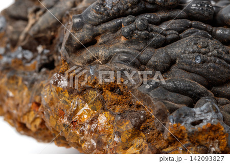 Macro mineral Hematite stone on a white background close-up Macro mineral Hematite stone on a white background close-up 142093827