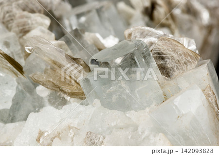 Macro mineral stone Aquamarine in rock on a black background Macro mineral stone Aquamarine in rock on a black background 142093828