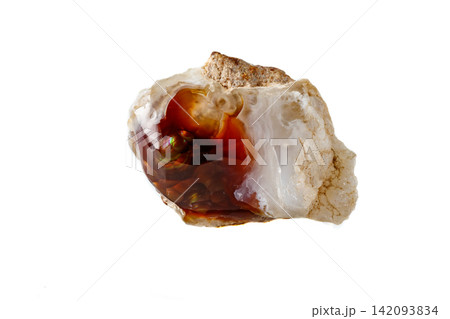 Macro mineral stone fiery Agate on a white background Macro mineral stone fiery Agate on a white background 142093834
