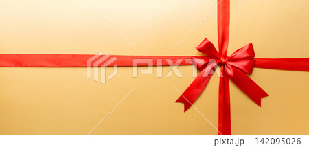 Top view of Red ribbon rolled and red bow isolated on colored background. Flat lay with copy space Top view of Red ribbon rolled and red bow isolated on colored background. Flat lay with copy space 142095026
