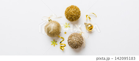 Christmas ball on colored background. decoration bauble with ribbon bow with copy space Christmas ball on colored background. decoration bauble with ribbon bow with copy space 142095183