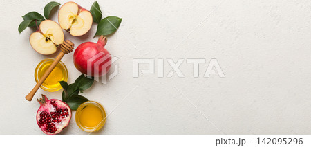 Flat lay composition with symbols jewish Rosh Hashanah holiday attributes on colored background, Rosh hashanah concept. New Year holiday Traditional. Top view with copy space Flat lay composition with symbols jewish Rosh Hashanah holiday attributes on colored background, Rosh hashanah concept. New Year holiday Traditional. Top view with copy space 142095296