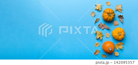 Autumn composition. Pattern made of dried leaves and other design accessories on table. Flat lay, top view Autumn composition. Pattern made of dried leaves and other design accessories on table. Flat lay, top view 142095357