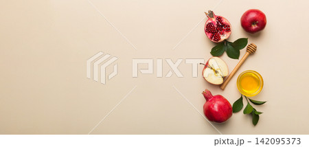Flat lay composition with symbols jewish Rosh Hashanah holiday attributes on colored background, Rosh hashanah concept. New Year holiday Traditional. Top view with copy space Flat lay composition with symbols jewish Rosh Hashanah holiday attributes on colored background, Rosh hashanah concept. New Year holiday Traditional. Top view with copy space 142095373