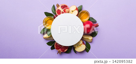 Flat lay composition with Blank flyer poster and symbols jewish Rosh Hashanah holiday attributes on colored background, New Year holiday Traditional. Top view with copy space mock up 142095382