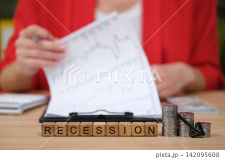 Understanding economic trends and the impact of recession on financial health and planning decisions at a modern office setting 142095608