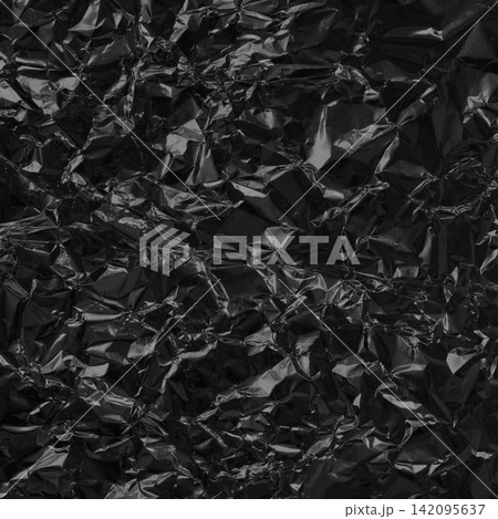 Shiny black grey foil metal texture, abstract wrapping paper for background and design art work. Shiny black grey foil metal texture, abstract wrapping paper for background and design art work. 142095637