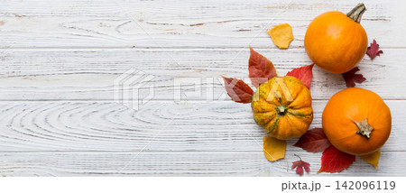 Autumn composition. Pattern made of dried leaves and other design accessories on table. Flat lay, top view Autumn composition. Pattern made of dried leaves and other design accessories on table. Flat lay, top view 142096119