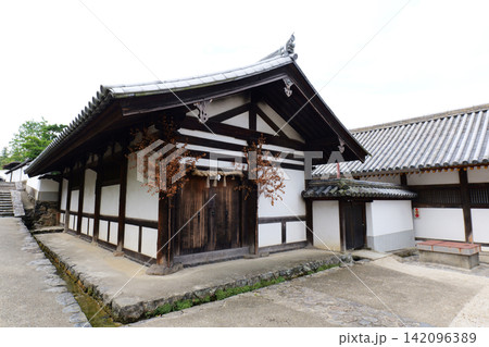 Traditional Japanese old town with stone walls and historic wooden houses in Nara, Japan 142096389