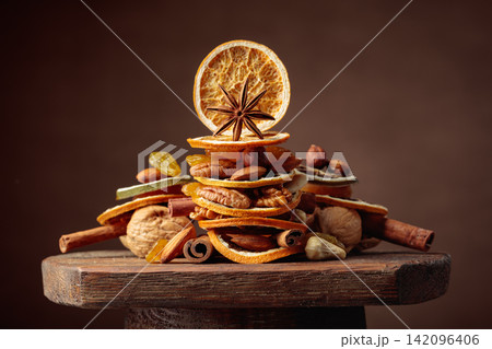 Christmas still-life with dried fruits, nuts, and spices. 142096406