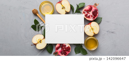 Flat lay composition with Blank flyer poster and symbols jewish Rosh Hashanah holiday attributes on colored background, New Year holiday Traditional. Top view with copy space mock up Flat lay composition with Blank flyer poster and symbols jewish Rosh Hashanah holiday attributes on colored background, New Year holiday Traditional. Top view with copy space mock up 142096647