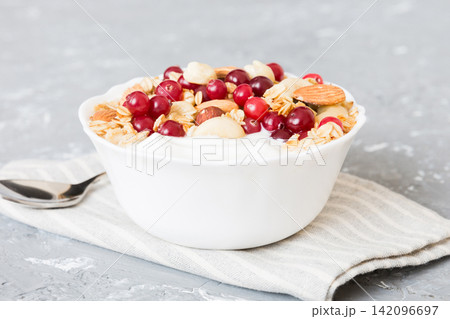 Healthy breakfast food with granola, yogurt, fruits and nuts. Dessert parfait with dried fruits for breakfast Healthy breakfast food with granola, yogurt, fruits and nuts. Dessert parfait with dried fruits for breakfast 142096697