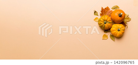 Autumn composition. Pattern made of dried leaves and other design accessories on table. Flat lay, top view Autumn composition. Pattern made of dried leaves and other design accessories on table. Flat lay, top view 142096765