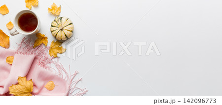 Flat lay composition with colorful Autumn cup of coffee and leaves on a color background. top view 142096773