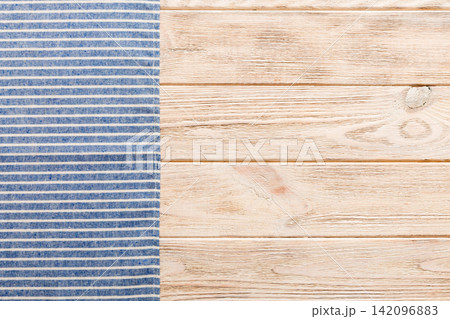 top view with blue kitchen napkin isolated on table background. Folded cloth for mockup with copy space, Flat lay. Minimal style 142096883