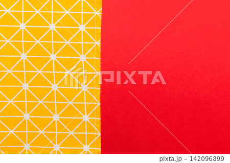 top view with yellow empty kitchen napkin isolated on table background. Folded cloth for mockup with copy space, Flat lay. Minimal style top view with yellow empty kitchen napkin isolated on table background. Folded cloth for mockup with copy space, Flat lay. Minimal style 142096899
