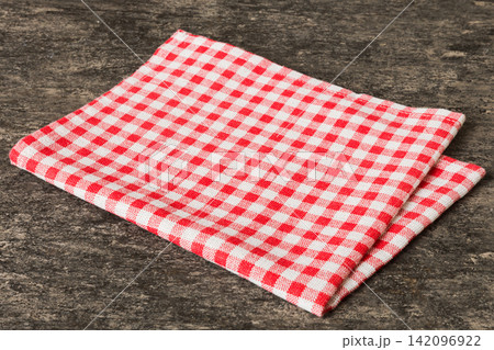 top view with red empty kitchen napkin isolated on table background. Folded cloth for mockup with copy space, Flat lay. Minimal style top view with red empty kitchen napkin isolated on table background. Folded cloth for mockup with copy space, Flat lay. Minimal style 142096922
