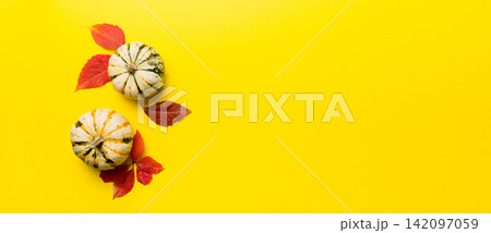 Autumn composition. Pattern made of dried leaves and other design accessories on table. Flat lay, top view Autumn composition. Pattern made of dried leaves and other design accessories on table. Flat lay, top view 142097059