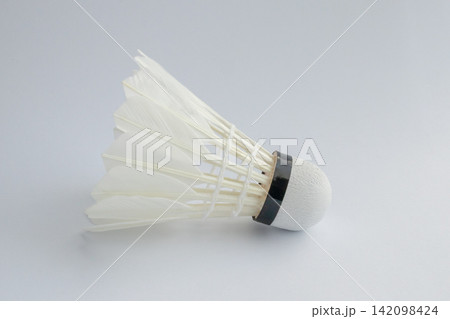 feather badminton shuttlecock on white paper texture background feather badminton shuttlecock on white paper texture background 142098424