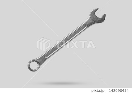 Wrench fly over gray background close up Wrench fly over gray background close up 142098434