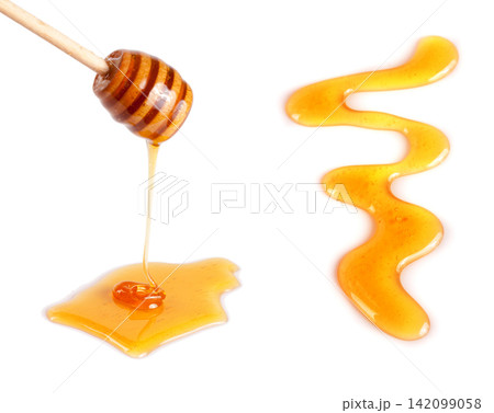 Honey stick with flowing honey isolated on white background 142099058