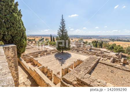 Historical landscape of Medina Azahara ruins near Cordoba, Spain. Panoramic archaeological site view perfect for educational, tourism, travel advertising, and heritage stock media collections. Historical landscape of Medina Azahara ruins near Cordoba, Spain. Panoramic archaeological site view perfect for educational, tourism, travel advertising, and heritage stock media collections. 142099290