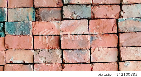 Weathered red brick wall texture with a rustic industrial pattern. Weathered red brick wall texture with a rustic industrial pattern. 142100883