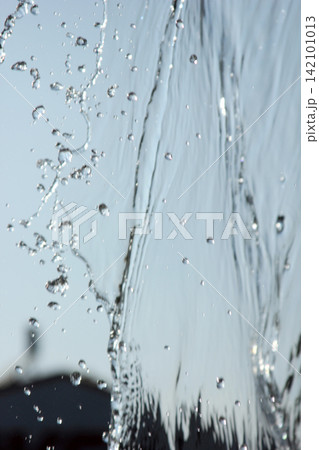 Splashing water with blue background 142101013