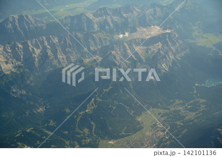 Aerial view of rugged Swiss Alps and glacial valleys 142101136