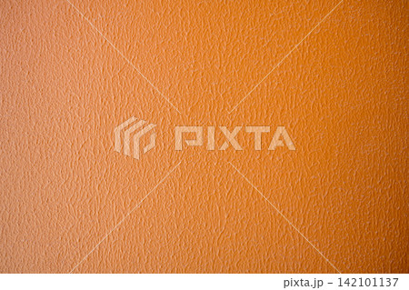 Orange textured wall background, warm color abstract texture for design and copy space Keywords 142101137