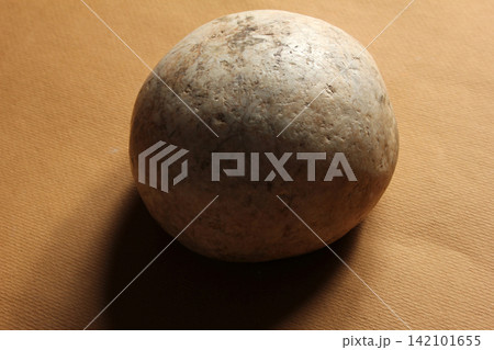 round stone on colored background round stone on colored background 142101655