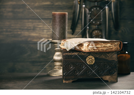 Vintage Chest with Journal and Candlelight Ambiance Vintage Chest with Journal and Candlelight Ambiance 142104732