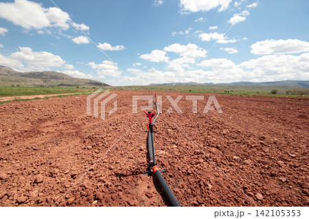 Irrigation system, water saving irrigation system agricultural background 142105353