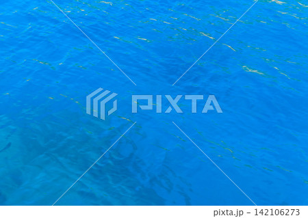 Blue water texture background. Surface of the sea 142106273