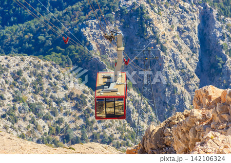 Cable car on ropeway leading to a top of Tahtali mountain in Antalya province, Turkey Cable car on ropeway leading to a top of Tahtali mountain in Antalya province, Turkey 142106324